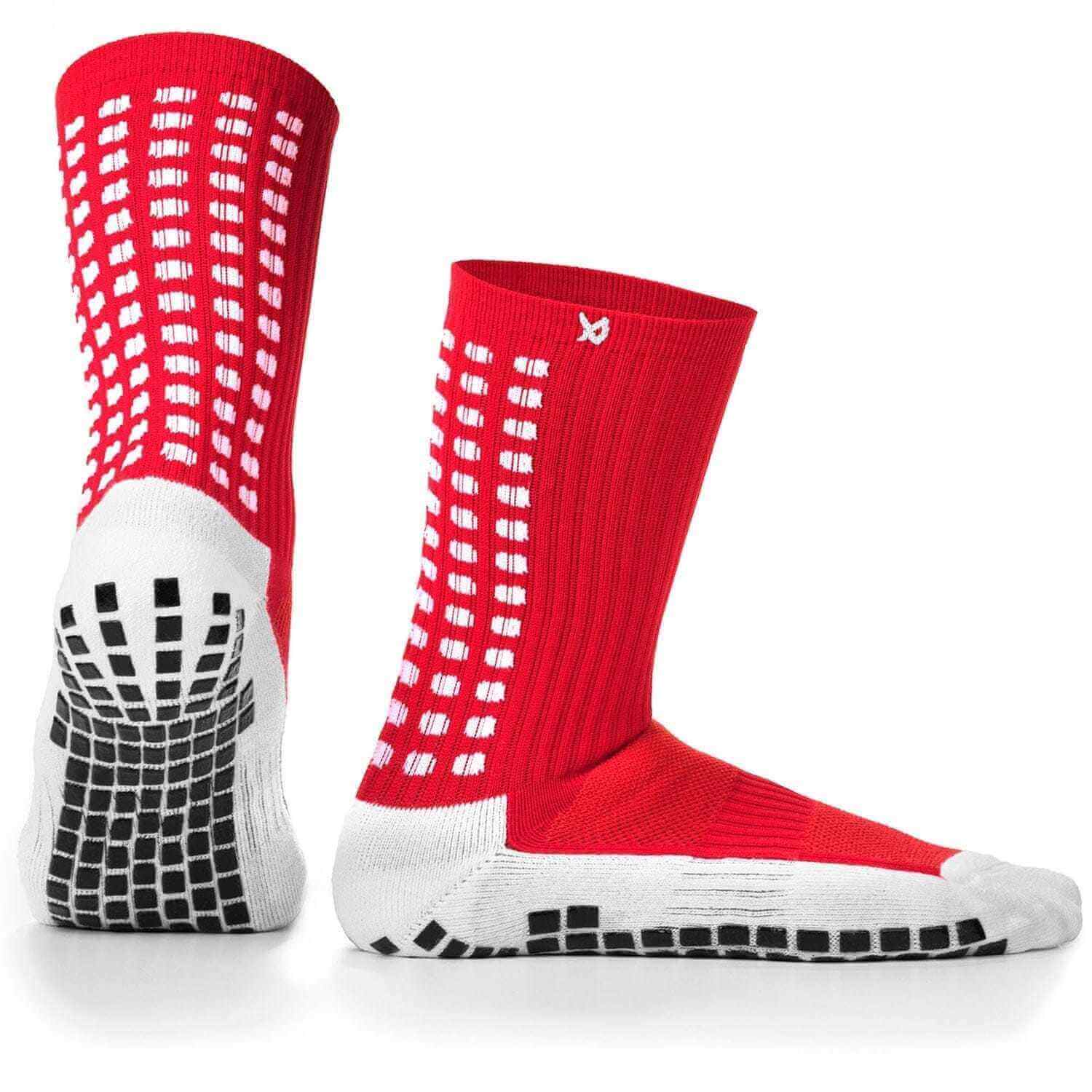 Red and white LUX anti-slip soccer socks with advanced grip technology.