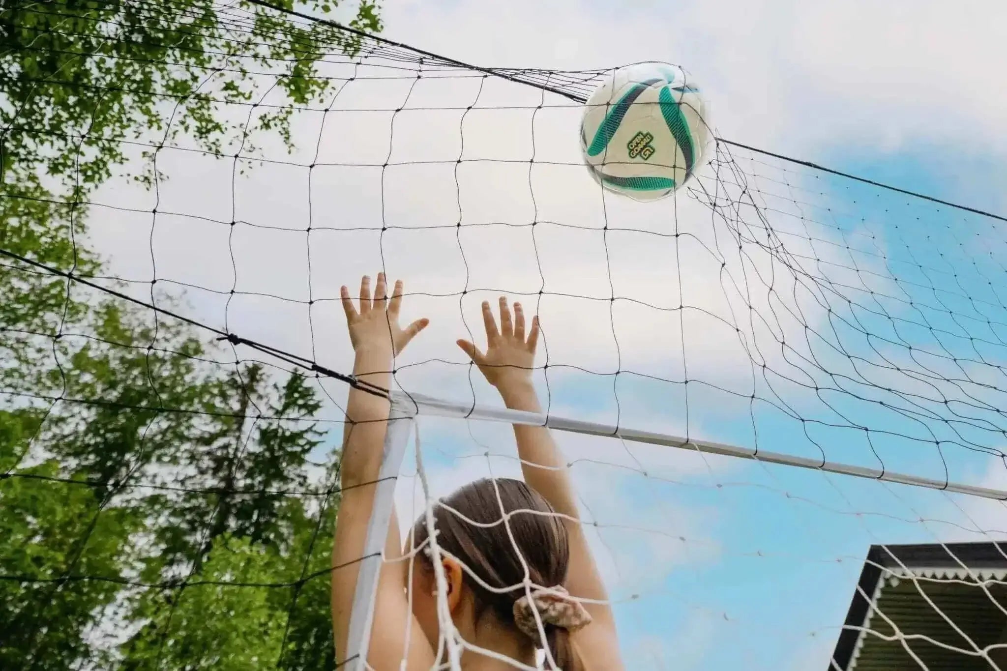 Standard-size 3-in-1 soccer trainer with goal, rebounder, and backstop.