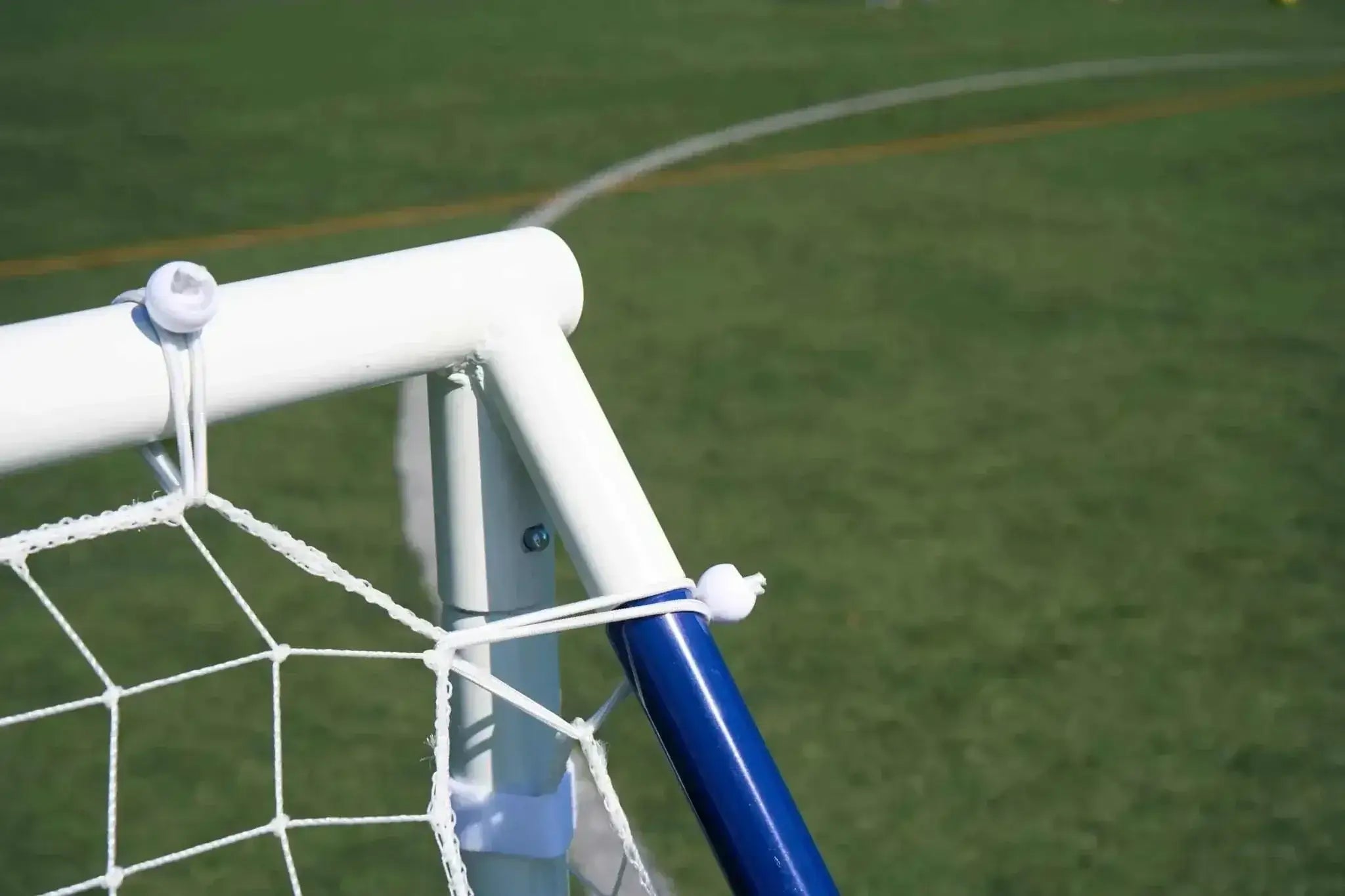 3-in-1 soccer goal rebounder with durable frame and net on grass field