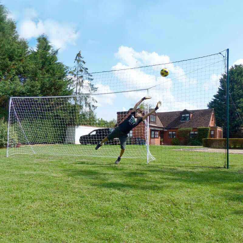 3-in-1 large soccer goal trainer with rebounder net in backyard setting