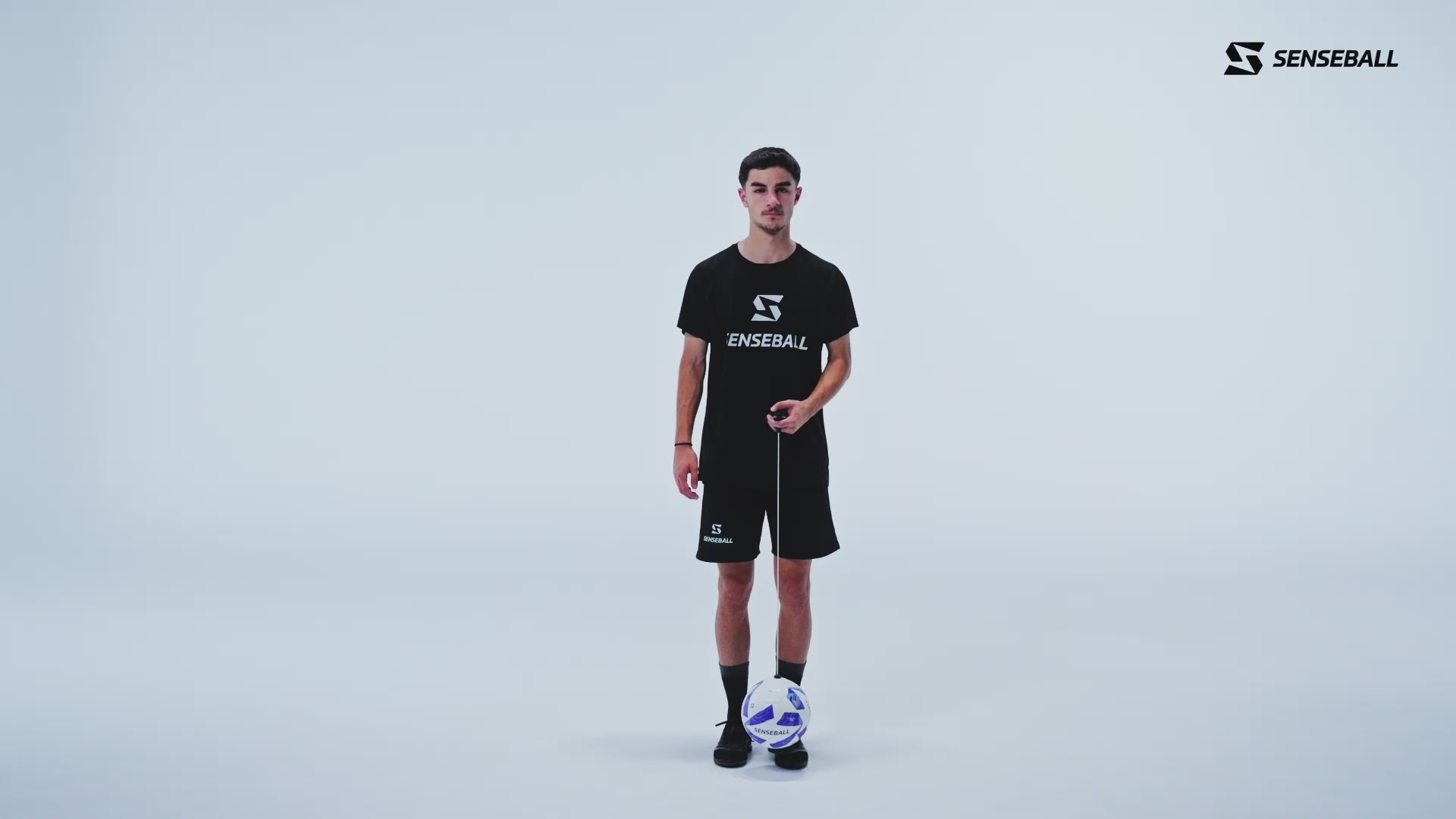 Young player practicing soccer speed drill with SenseBall football kick trainer