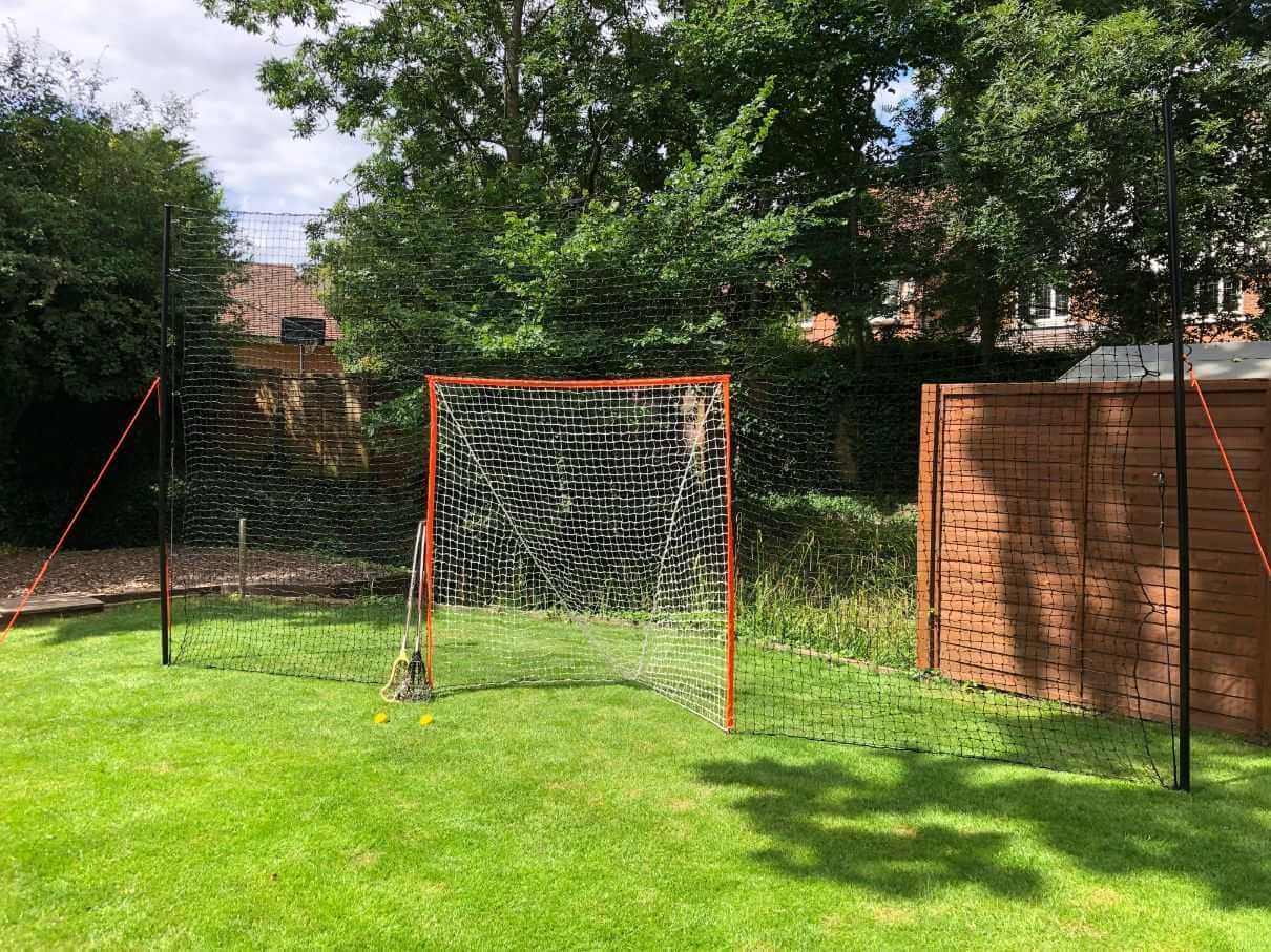 Open Goaaal® Lacrosse Goal 2-in-1 Trainer is your ultimate backyard trainer + backstop combo.