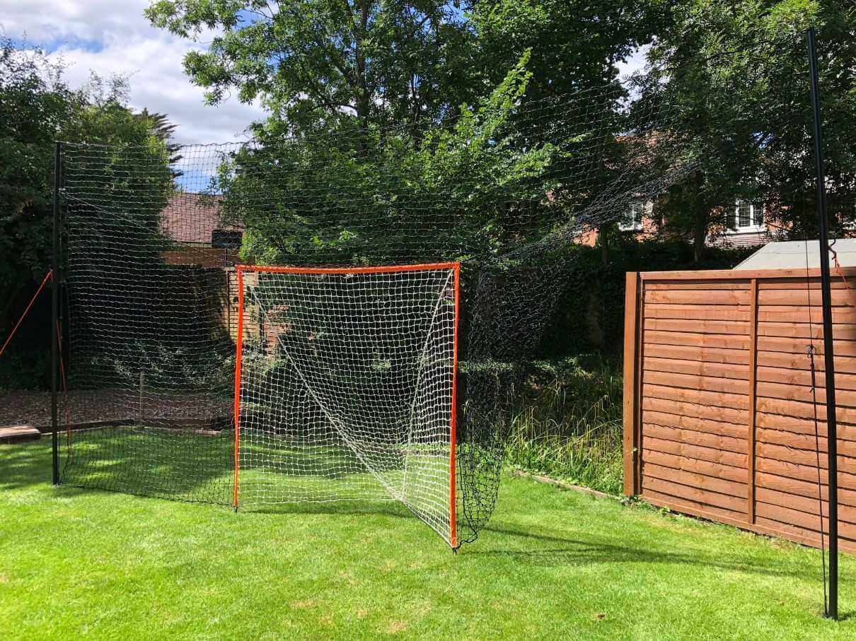 Open Goaaal® Lacrosse Goal 2-in-1 Trainer keeps the ball in play - perfect for grass practice.