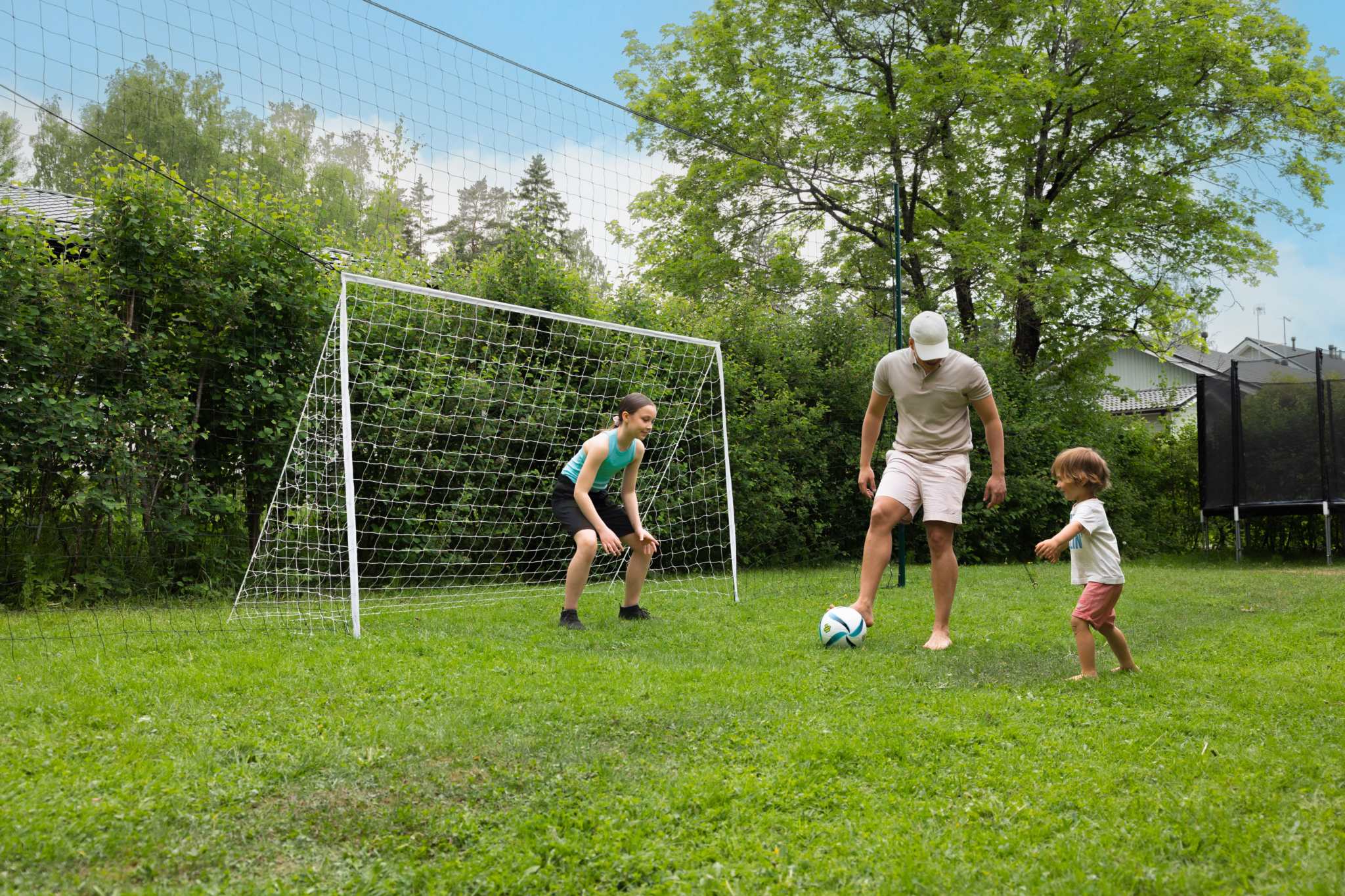 standard 3-in-1 soccer goal trainer with net in backyard for kids practice