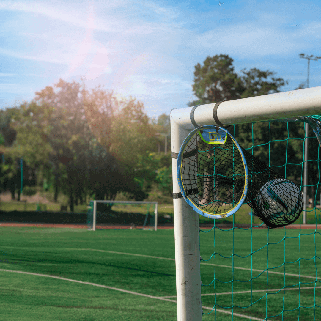 Soccer goal corner target attached to goalpost for shooting accuracy training on outdoor field