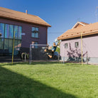 3-in-1 soccer goal trainer set up in backyard for kids' practice