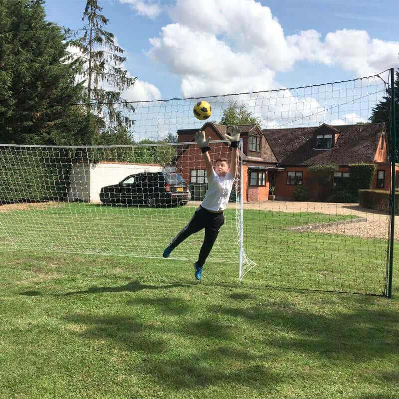 3-in-1 soccer rebounder goal with net and goalkeeper training in backyard